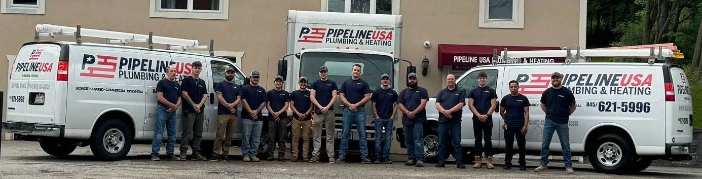 Pipeline USA employees and trucks lined up in front of building.