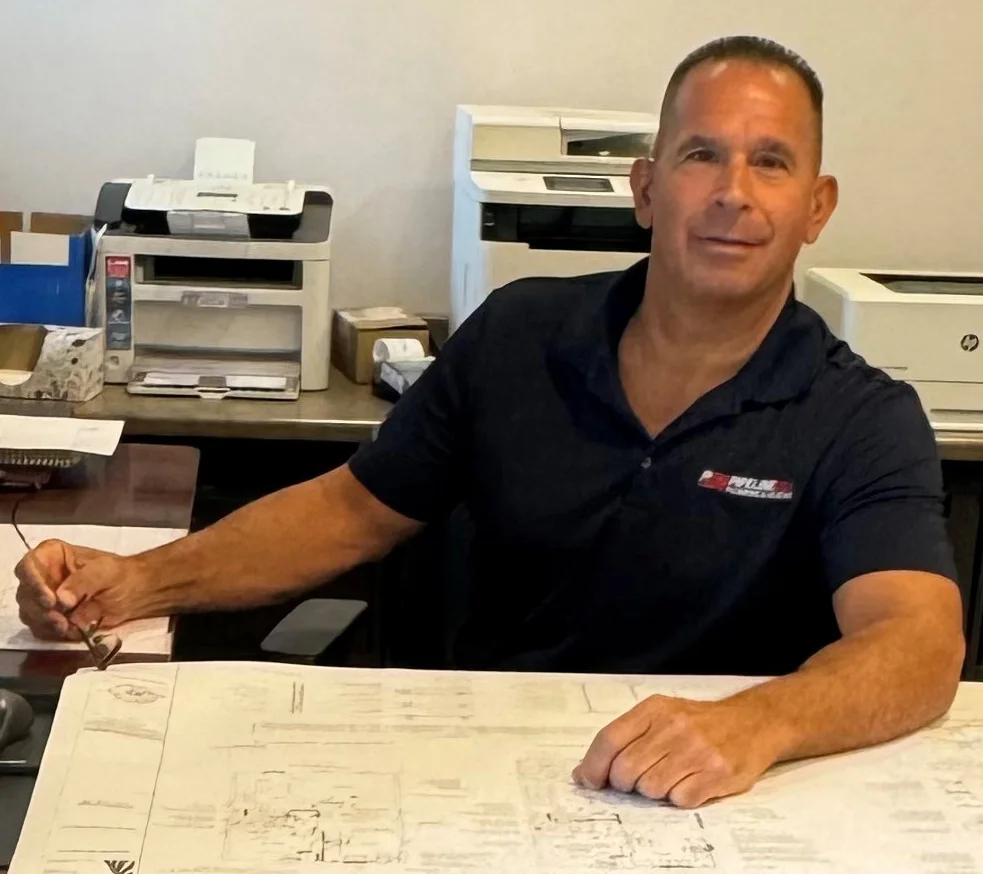 Ed Vitale sitting at his desk.