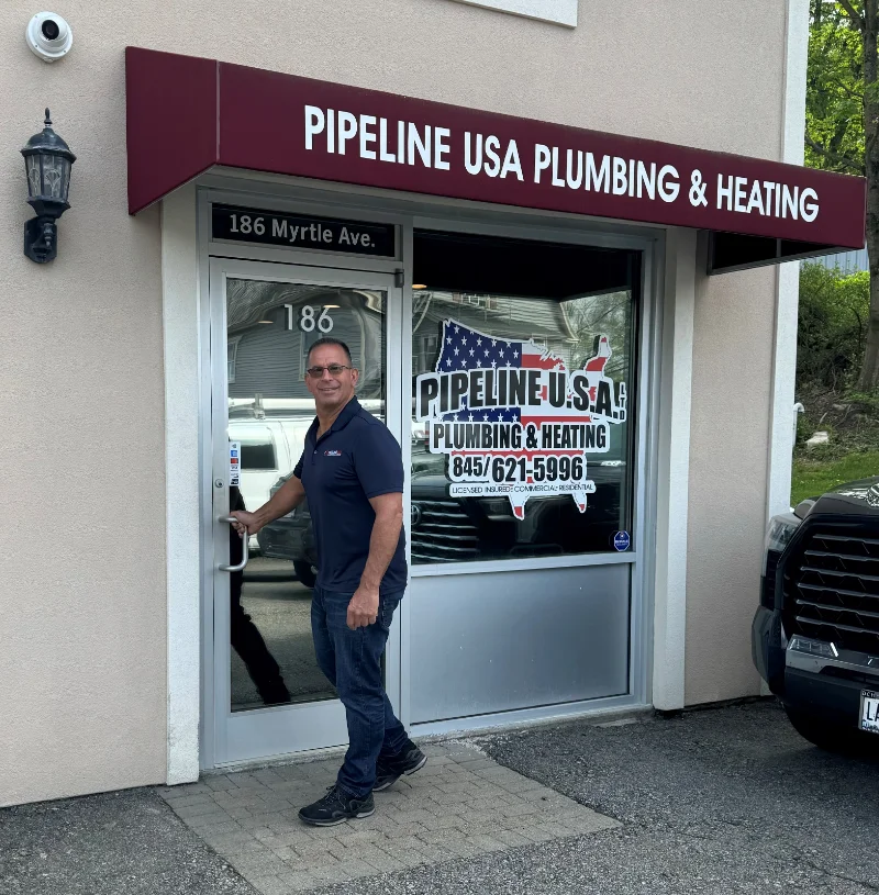 Pipeline USA storefront with man in front of the door.
