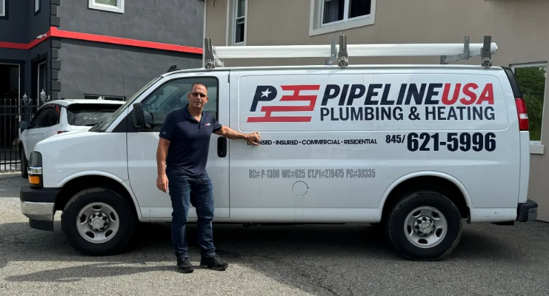 Pipeline USA van with plumber standing in front.